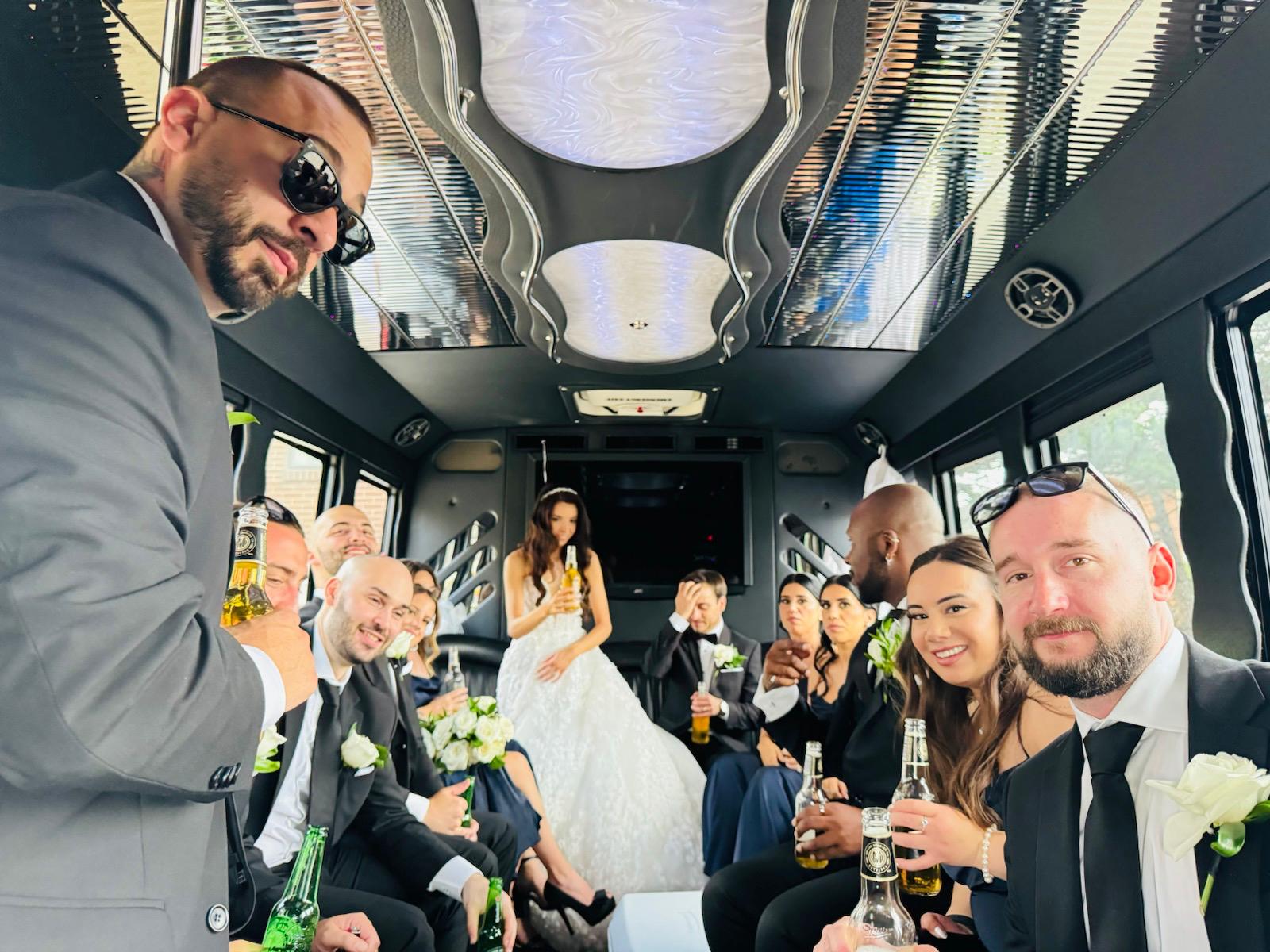Wedding party celebrating together inside a Toronto party bus rental