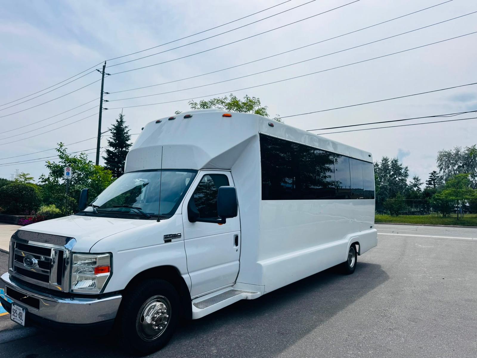 White 17-passenger party bus exterior for Toronto group transportation
