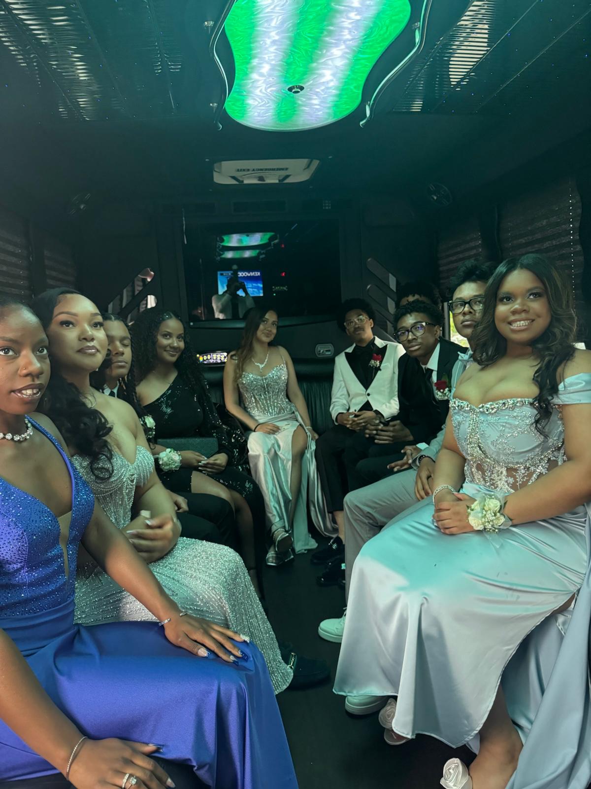 Prom group celebrating inside a luxury party bus in Toronto