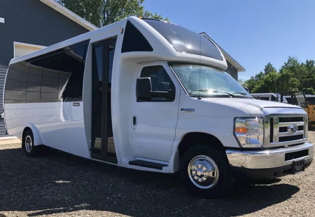 White limo party bus exterior with passenger entrance